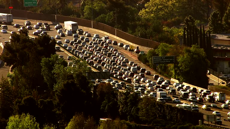 HD 1080p: Aerial view of rush hour traffic on busy freeway. Shot with a Cineflex gyro-stabilized camera system.