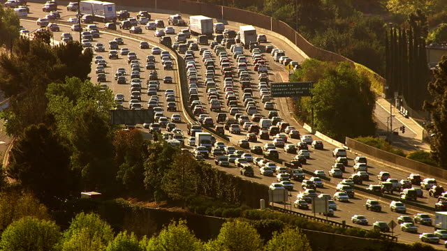 HD 1080p: Aerial view of rush hour traffic on busy freeway.  Shot with a Cineflex gyro-stabilized camera system.