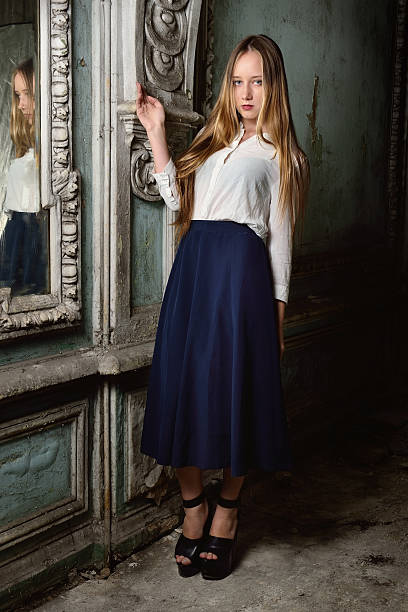 istock beautiful woman posing in obsolete interior. 483322727