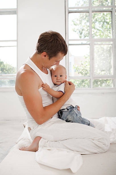 istock young father with his nine months old son on the 483322766