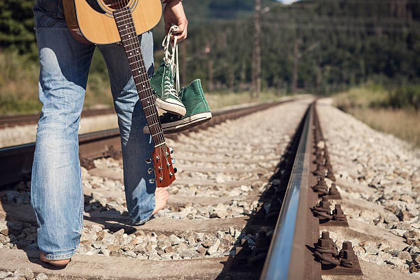 istock Alone traveler barefoot walk on the railway 483323966