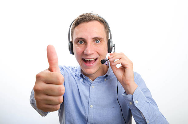 istock Smiling Male Callcenter Agent shows Thumb 483327560