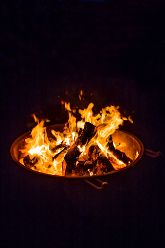 Sparking camp fire in dark