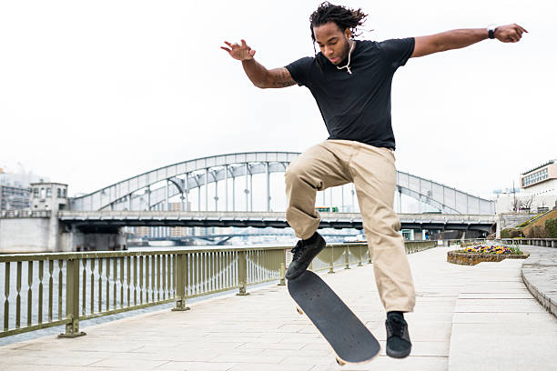 istock happiness african man skating and doing some trick 483327682