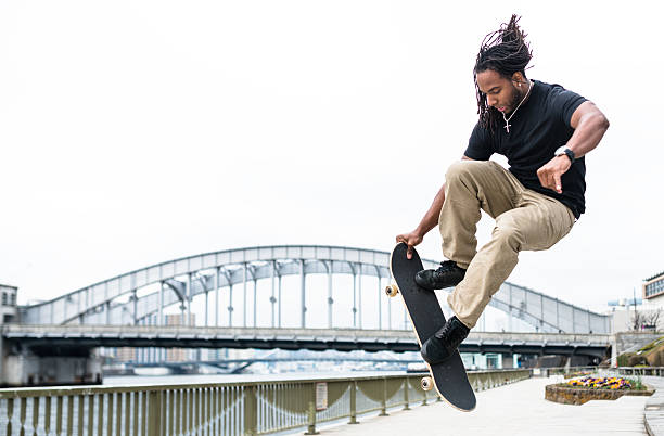 istock happiness african man skating and doing some trick 483327698