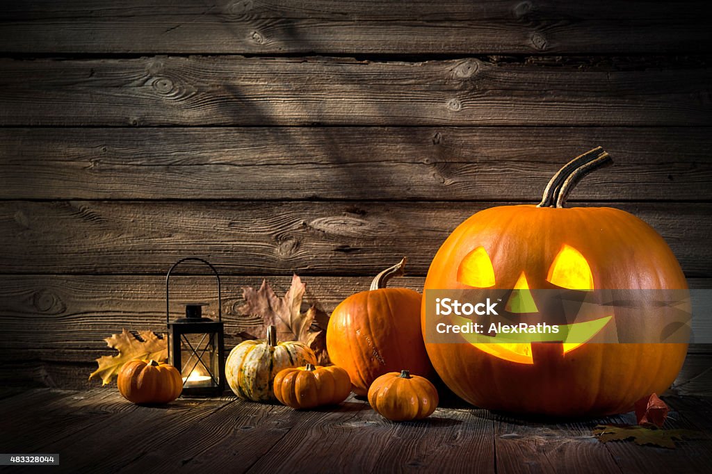 Halloween Pumpkins Halloween pumpkin head jack lantern on wooden background Halloween Stock Photo