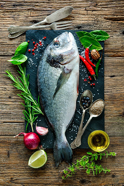 istock Fresh Gilt-head bream with spices and seasoning 483328172