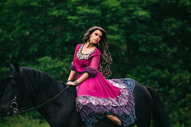 istock Beautiful woman on a horse 483332196