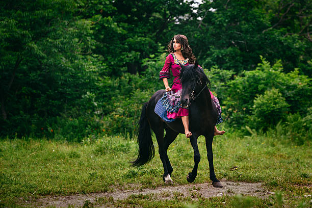 istock Beautiful woman on a horse 483332220
