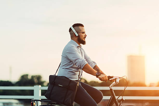 istock Businessman Ride Bicycle From Work and Listening Music. 483333074