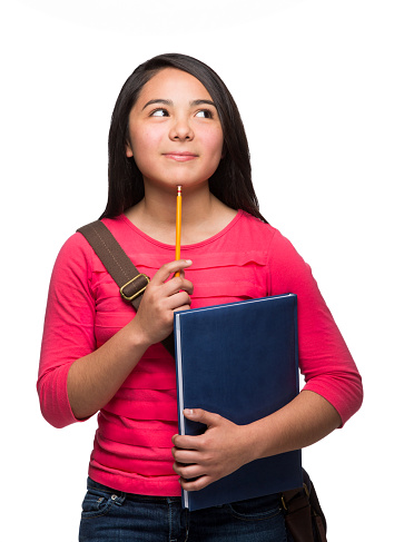 Close-up of contemplating girl holding book isolated over white background