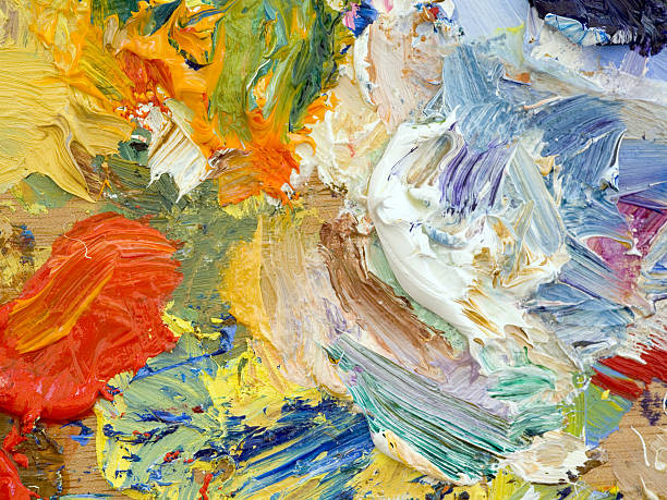 istock Oil paints palette vibrant multi-coloured full frame background close up 483336460