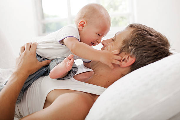 istock young father with his nine months old son on the 483337122
