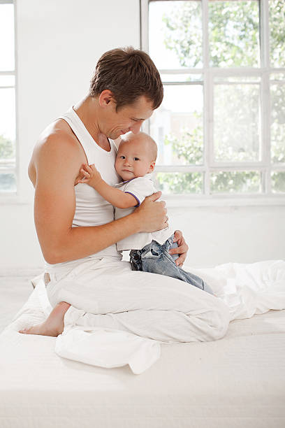 istock young father with his nine months old son on the 483337244