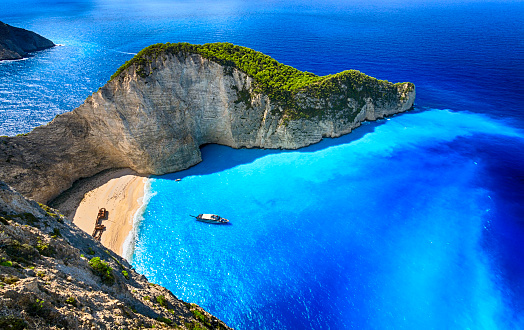 Famous Navagio beach (Smugglers Cove) with abandoned smuggler ship. Zakynthos island, Greece. ProPhoto RGB color space.