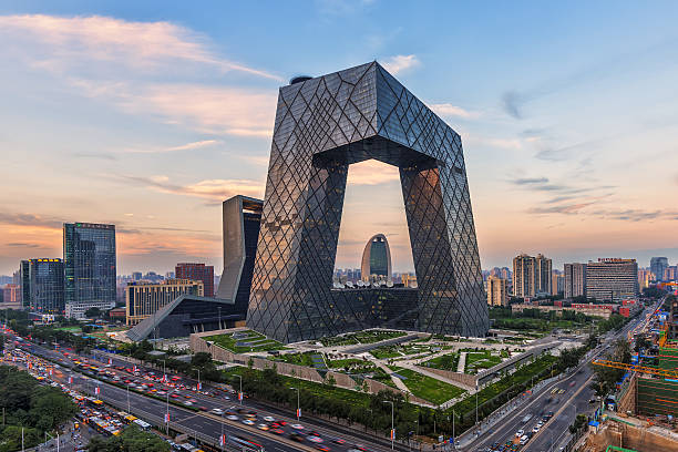 the setting sun, CCTV (CCTV) is very spectacular. Beijing,China-August 4th,2015：China's Beijing City, a famous landmark building, China CCTV (CCTV) 234 meters tall skyscrapers, the setting sun, CCTV (CCTV) is very spectacular. beijing stock pictures, royalty-free photos & images