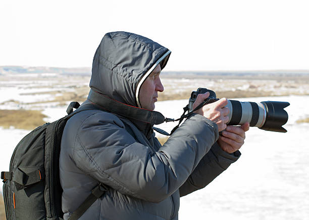 istock Man photographs landscape 483343033