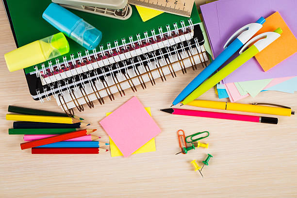 istock School and office accessories on wooden background 483343076