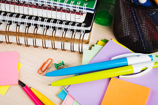 istock School and office accessories on wooden background 483343160