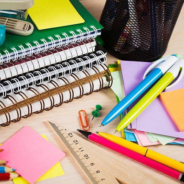 istock School and office accessories on wooden background 483343166