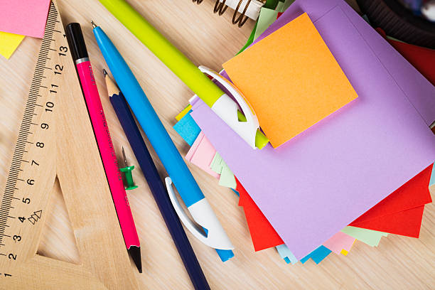 istock School and office accessories on wooden background 483343168