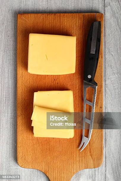 Bloque De Rodajas De Queso Foto de stock y más banco de imágenes de Alimento - Alimento, Amarillo - Color, Cortado