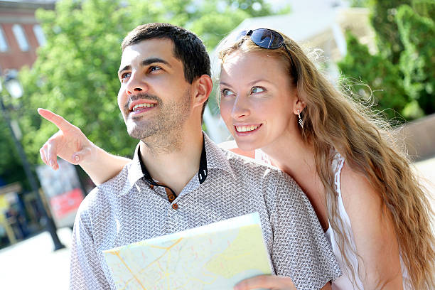 istock Young couple walking around the city 483343298