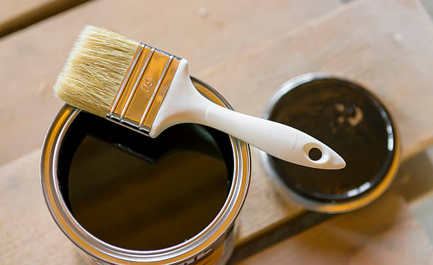 istock Brush in bank  with black paint 483343422