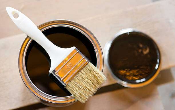 istock Brush in bank  with black paint 483343426