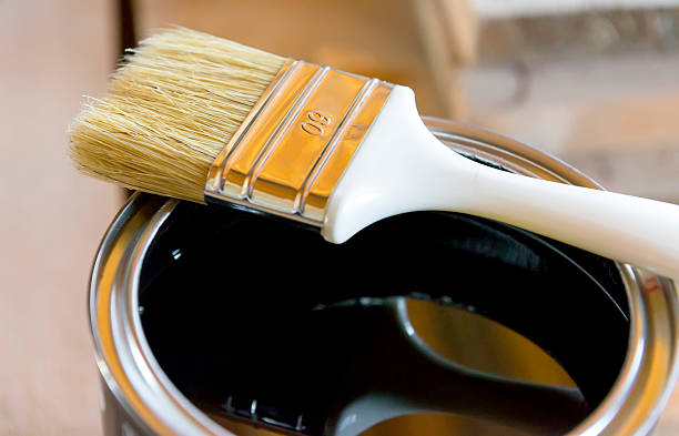 istock Brush in bank  with black paint 483343428