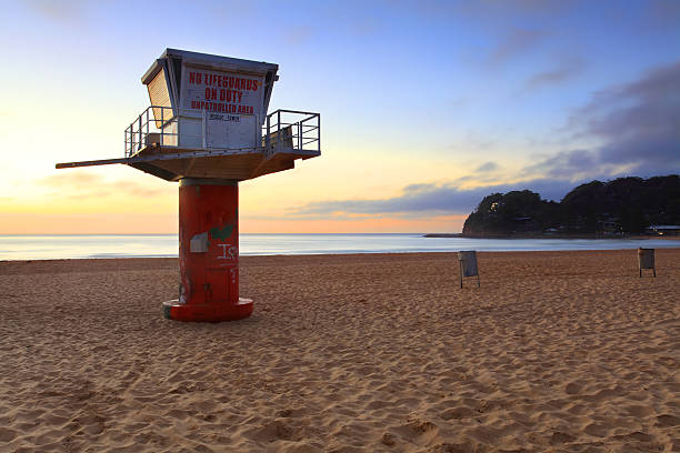 South Avoca Beach sunrise Sunrise at Avoca Beach, southern end with lifeguard tower avoca beach photos stock pictures, royalty-free photos & images