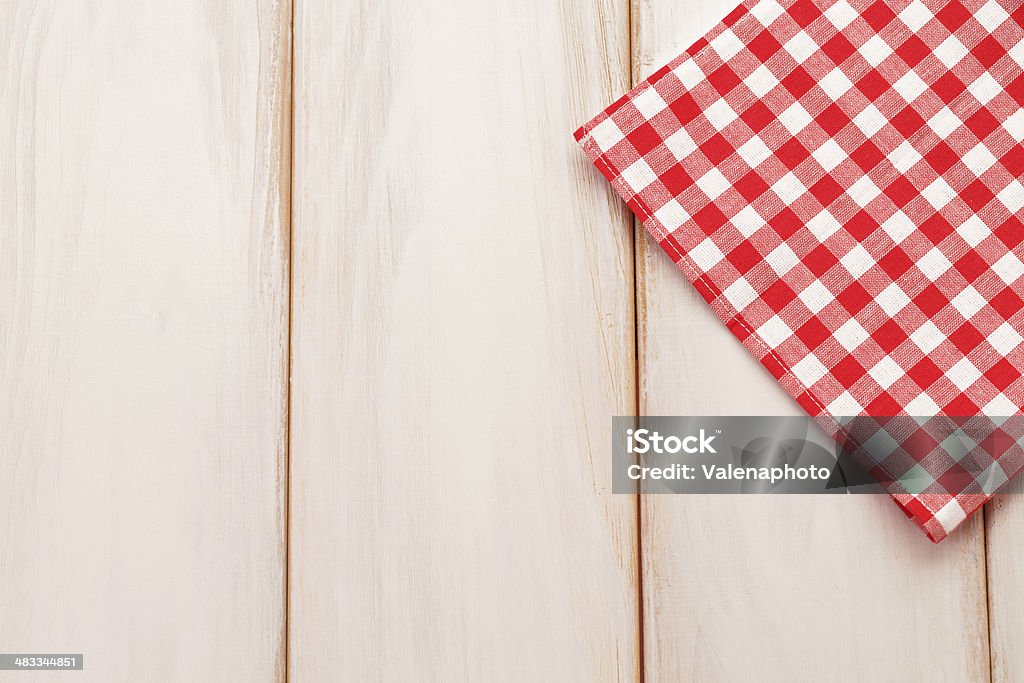 Plaid cloth on picnic table Red plaid cloth on wooden table. Food background Picnic Table Stock Photo