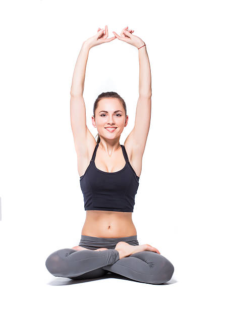 istock Young woman sitting in lotus position 483345665