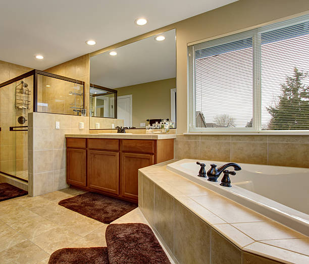 istock Gorgeous bathroom with glass shower, and large bath. 483346616