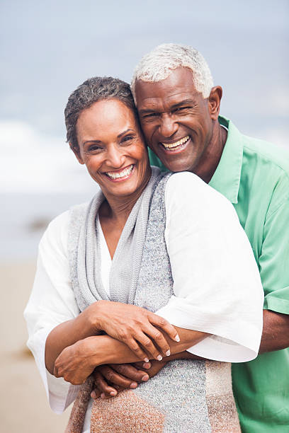 istock African American Seniors Smiling Together on Beach 483347441