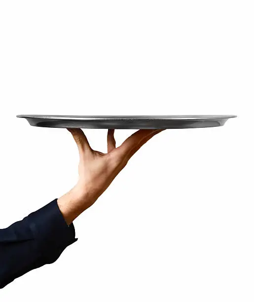 Empty plate or serving tray and human hand.