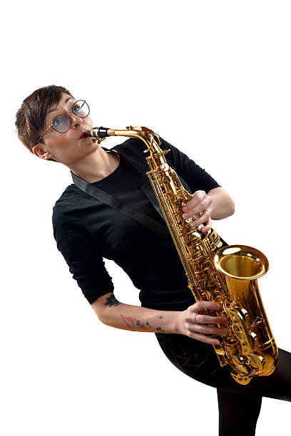 istock young woman playing the saxophone 483347653