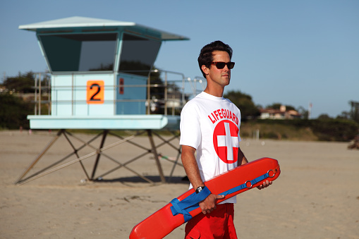 Male lifeguard at the ocean beach.