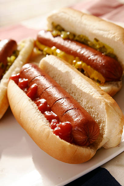 Hot dogs with condiments stock photo