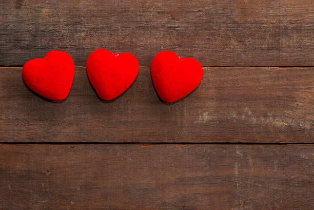 istock many Hearts on wood background 483357468