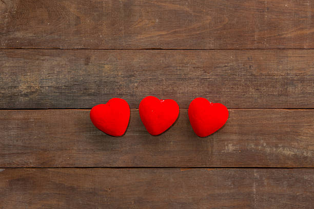 istock many Hearts on wood background 483357472