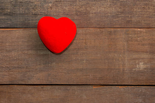 istock One Hearts on wood background 483357482