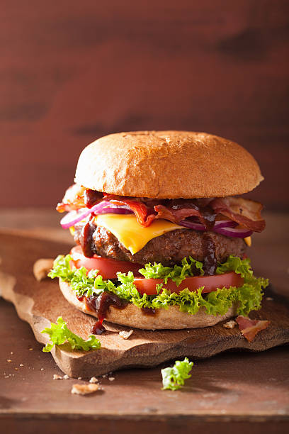 istock bacon cheese burger with beef patty tomato onion 483357514