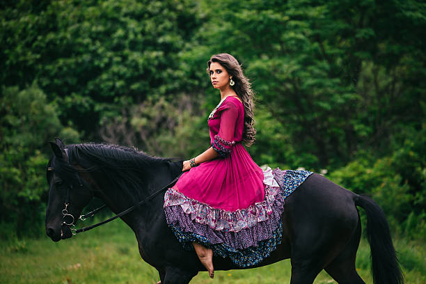istock Beautiful woman on a horse 483363068