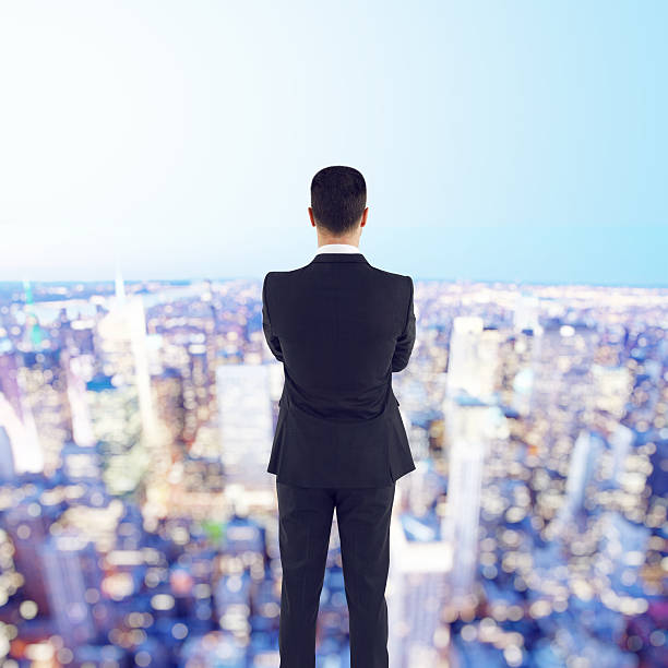 istock businessman looking to city 483364764