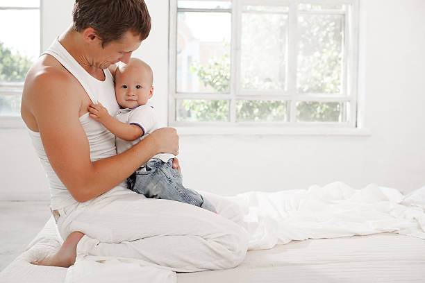 istock young father with his nine months old son on the 483365016