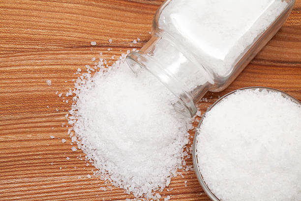 istock sea salt on wooden table 483370175