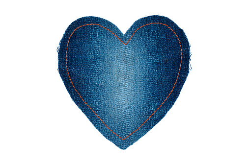 Symbolic heart made of jeans for the your of the text, isolated on white background