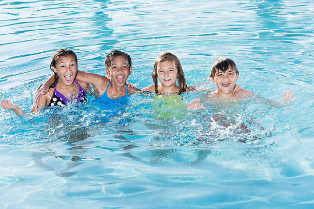 istock Children playing in swimming pool. 483371619