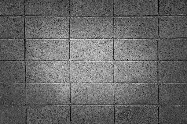 istock Square stone brick wall in black and white, background 483371714